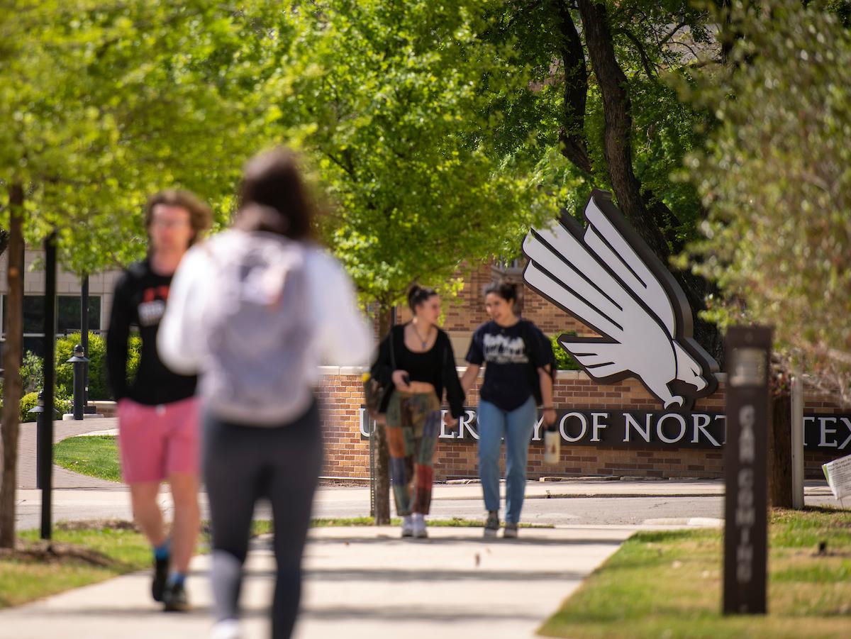Students walking across UNT campus