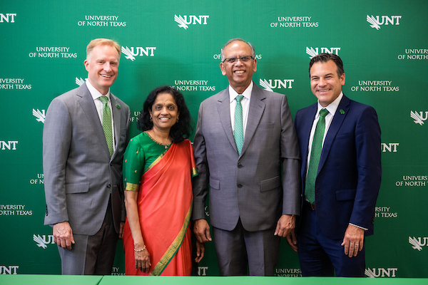 Vikas and Anu Sinha with Harrison Keller and Brandon Buzbee