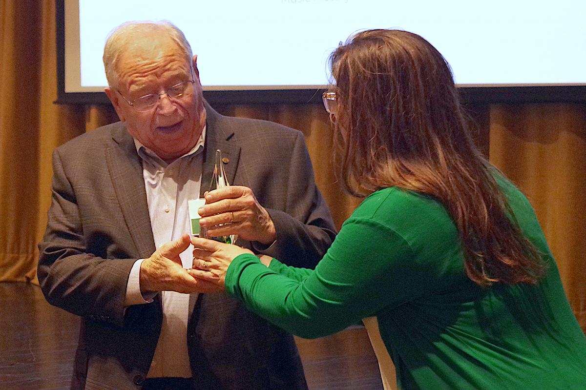 Max Mortley receiving an award