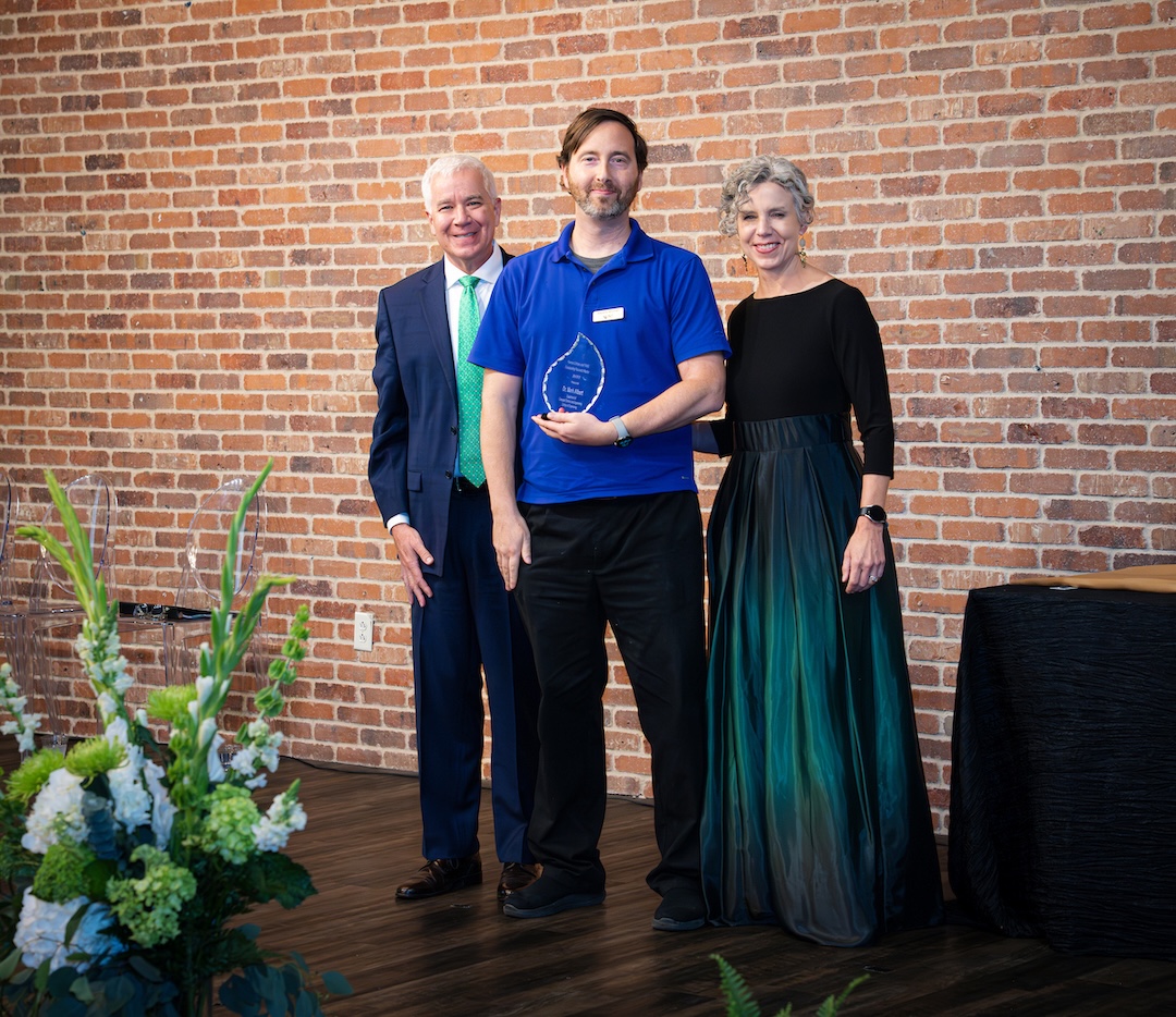 Mark Albert receiving award on stage