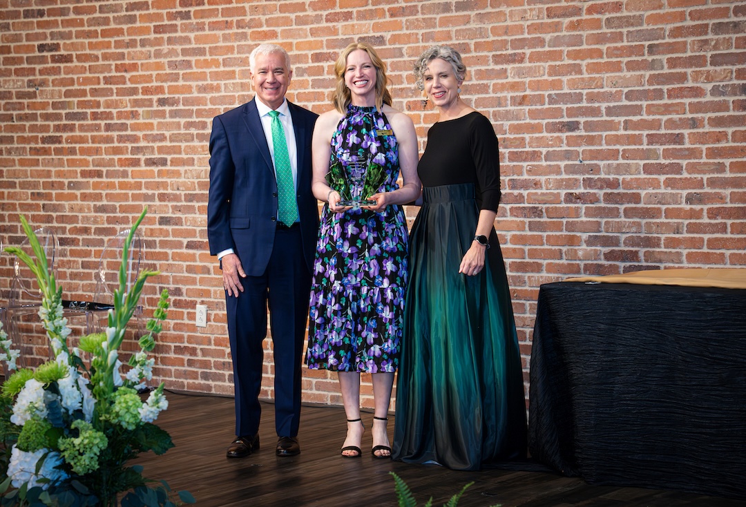 Sam Bergmann receiving award on stage