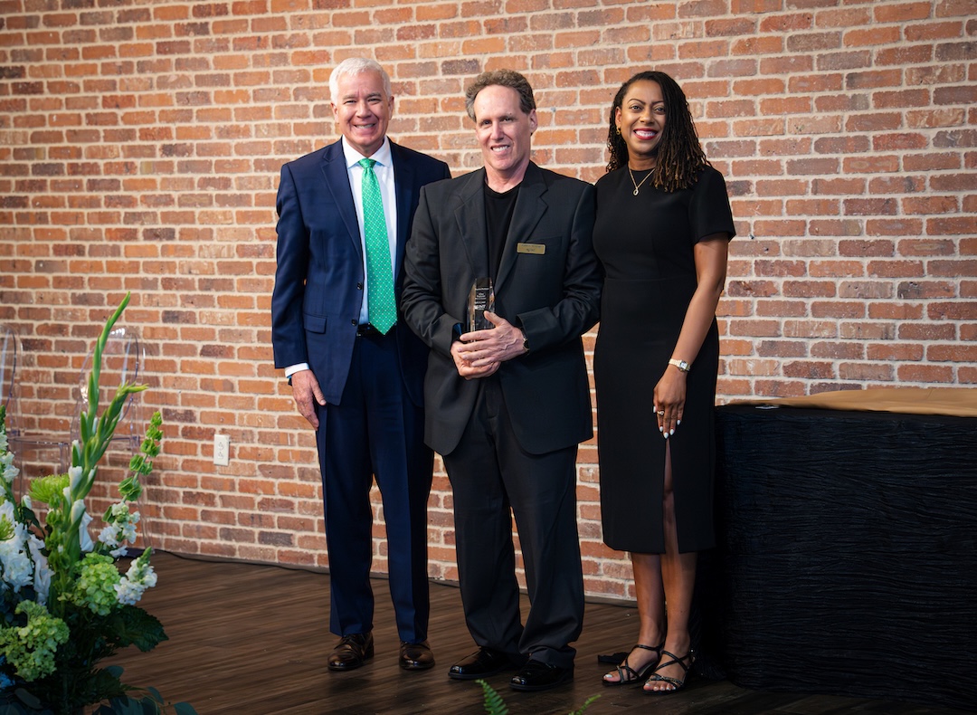 Glen Biglaiser receiving award on stage