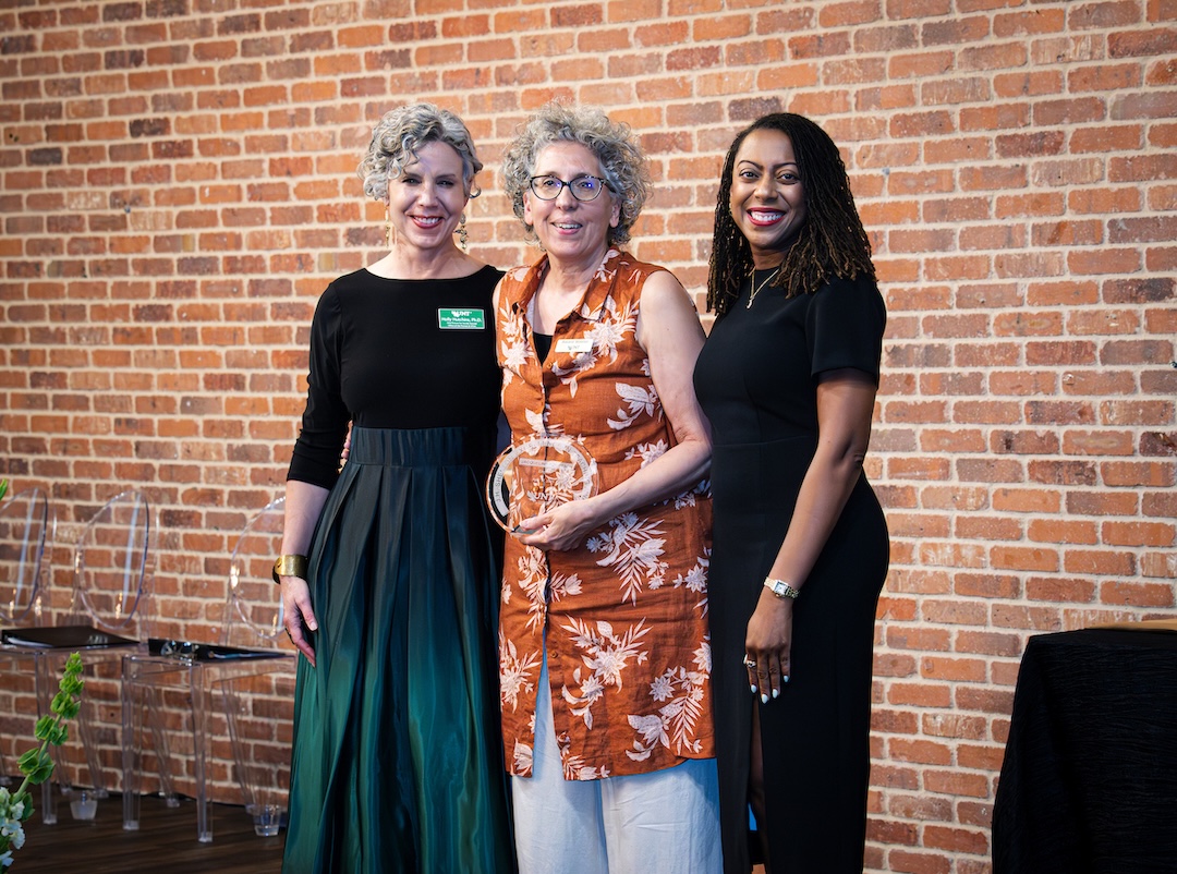 Jacqueline Foertsch receiving award on stage