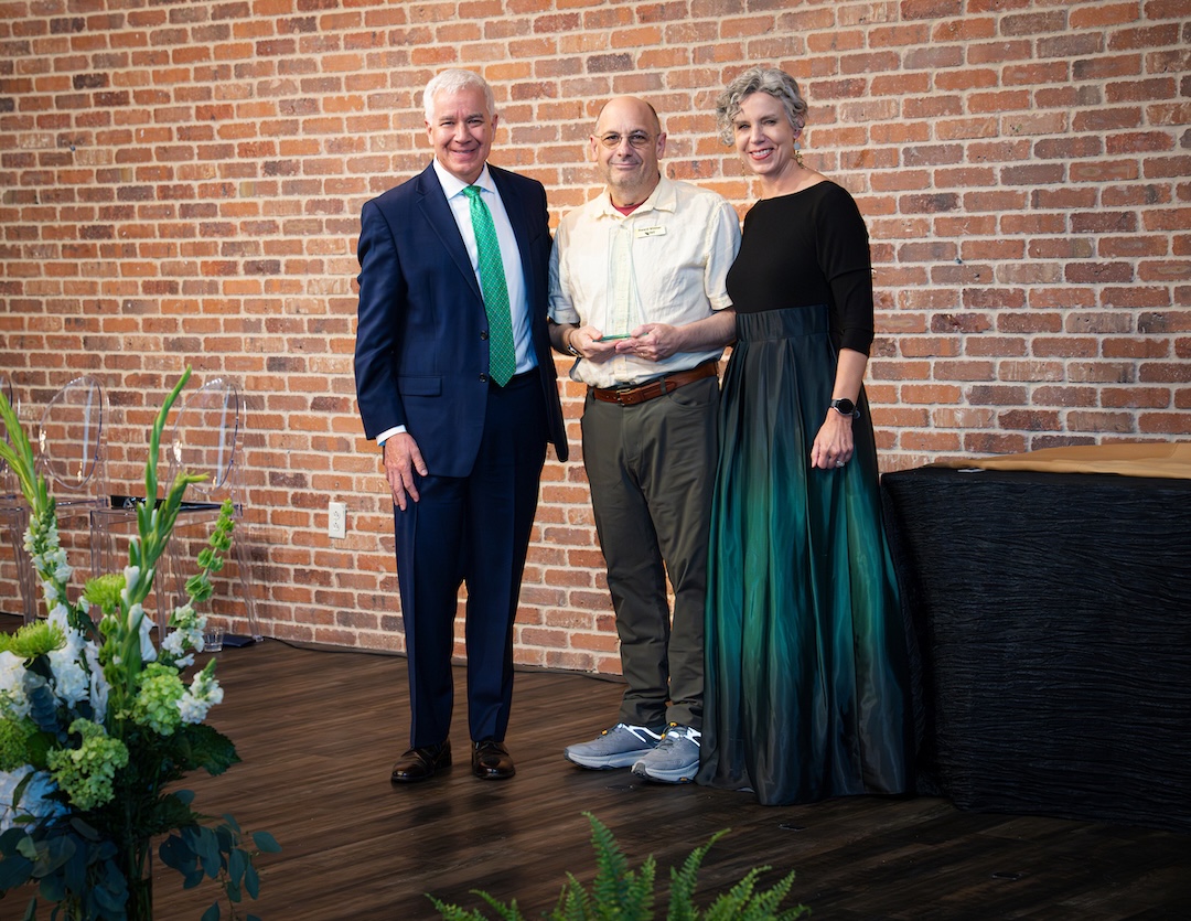 Eugene Martin receiving award on stage