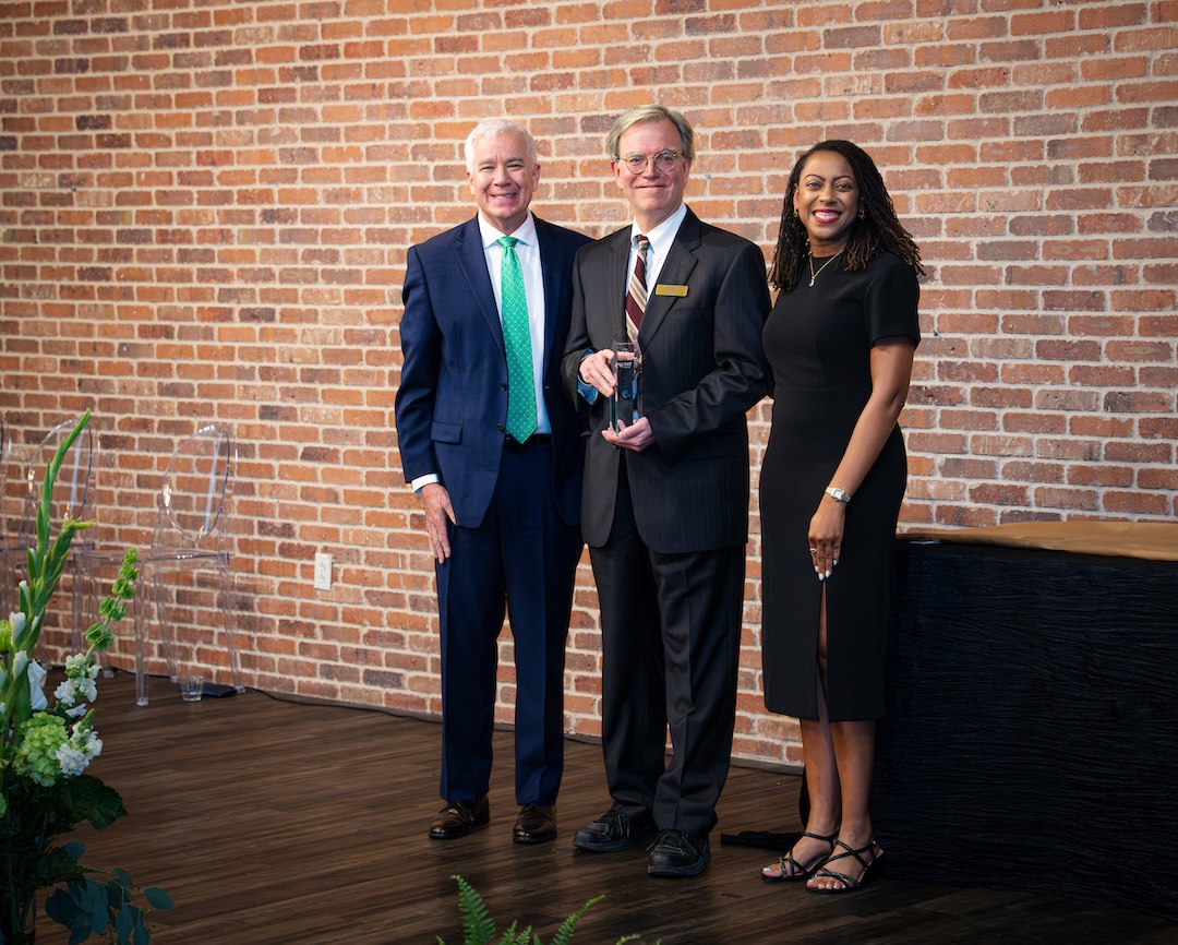 Eric Nestler receiving award on stage