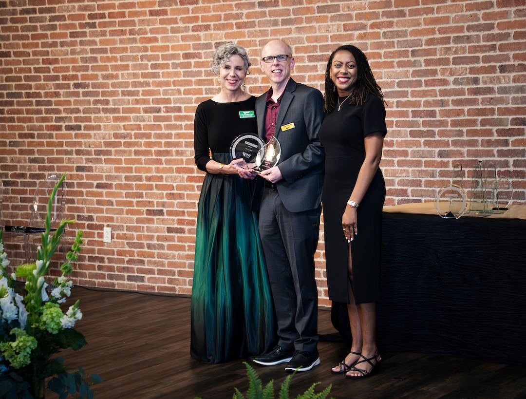 Wesley Phelps receiving awards on stage