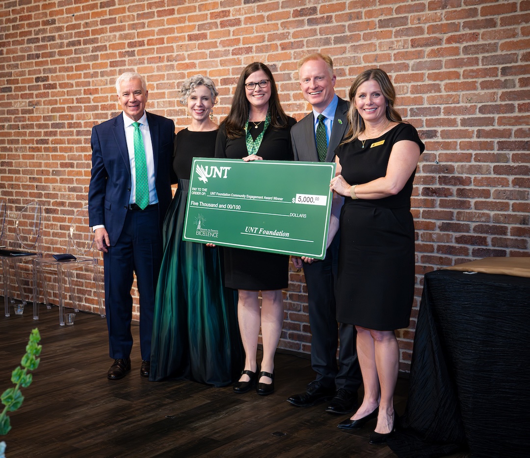 Brenda Sweeten receiving award on stage
