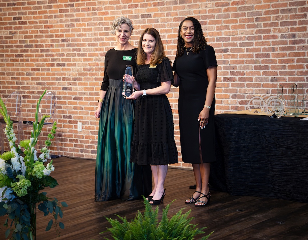 Susan Watson receiving award on stage