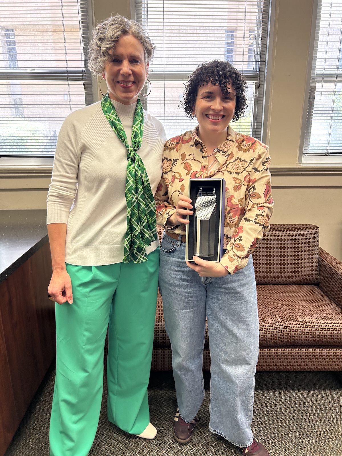 Jehanne Dubrow receiving award during surprise office visit
