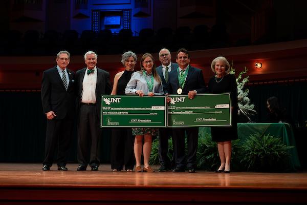 Jennifer Callahan and Camilo Ruggero accept the UNT Foundation Community Engagement Award at the 2022 Salute to Faculty Excellence