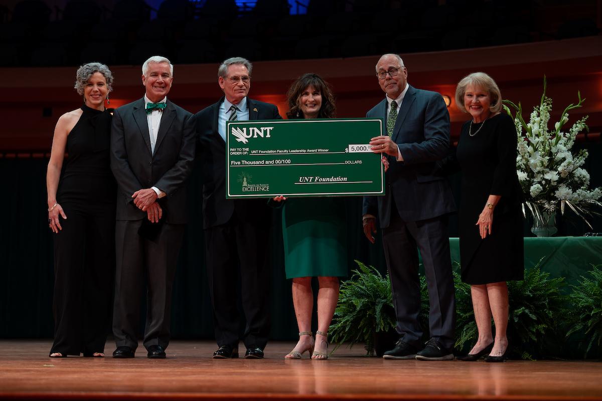  Christy Crutsinger accepts the UNT Foundation Faculty Leadership Award at the 2022 Salute to Faculty Excellence
