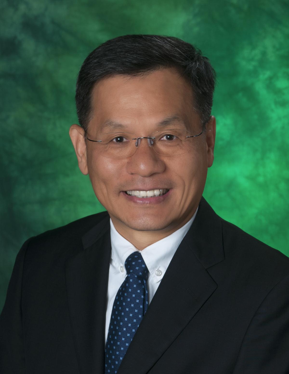 Wonbong Choi in front of green background