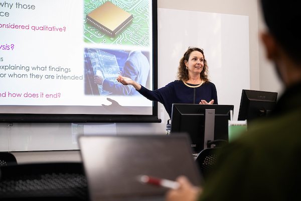 Faculty member presenting to class