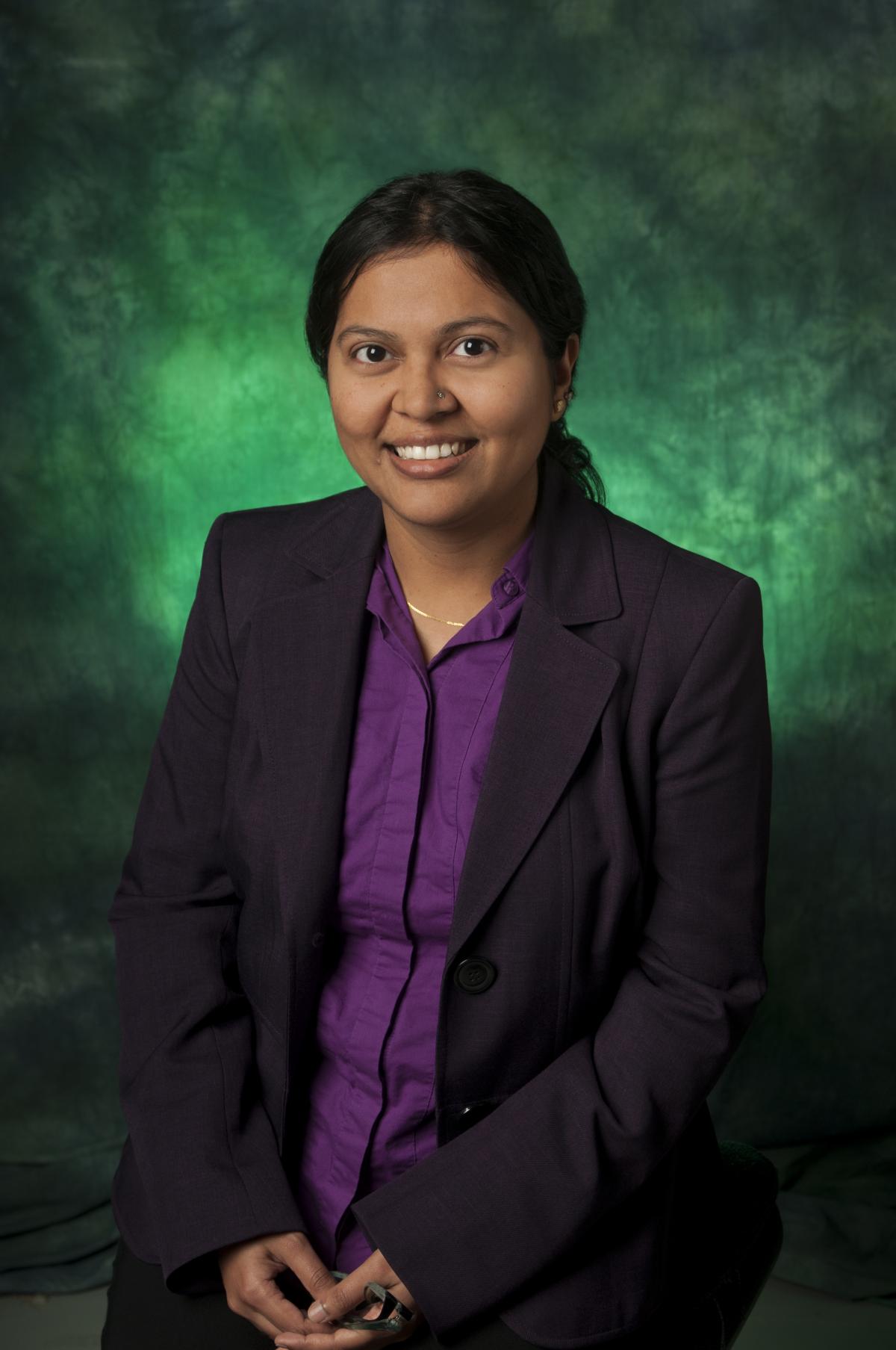 Ifana Mahbub in front of green background