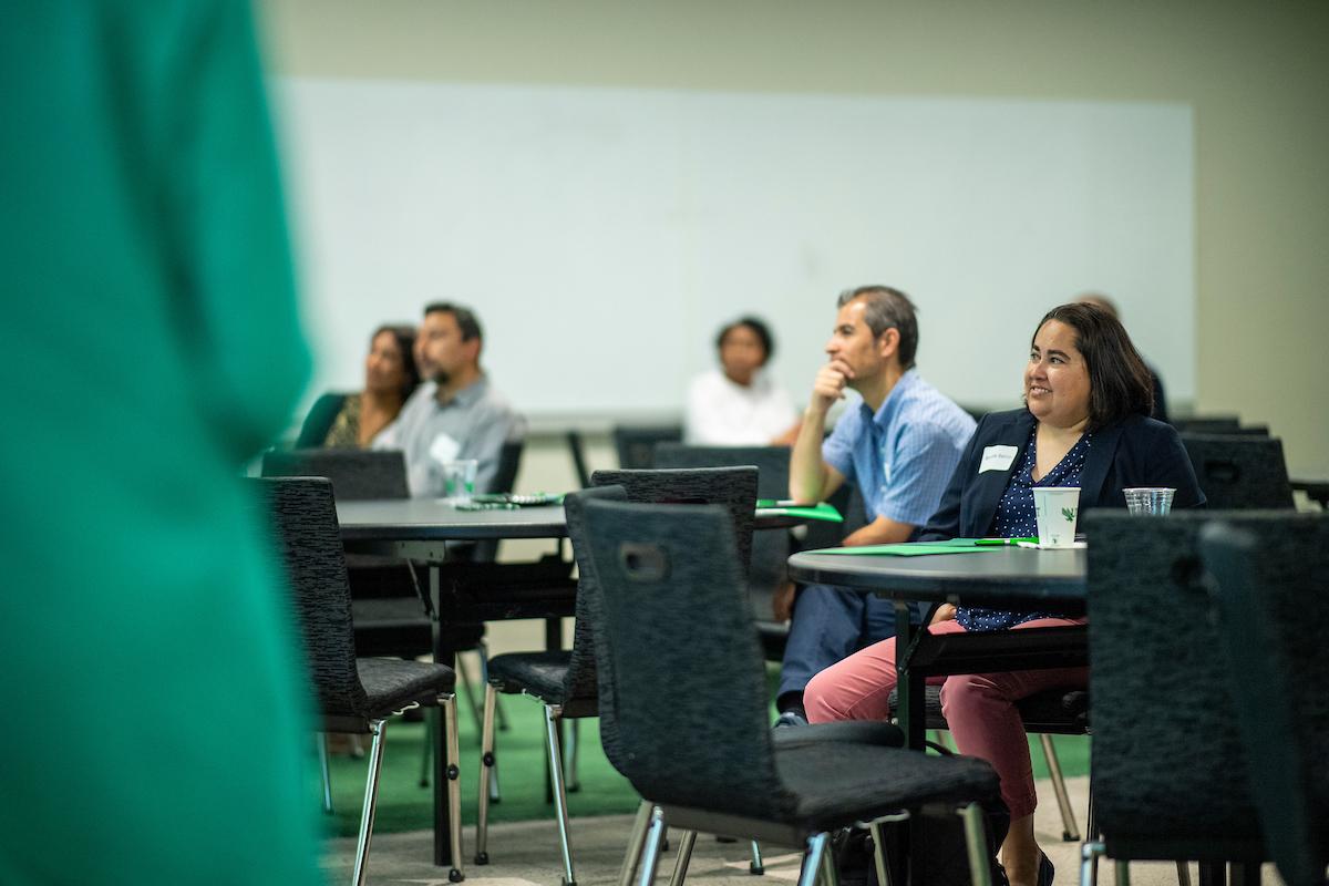  Faculty listening to presentations during Midcareer Promotion Workshop