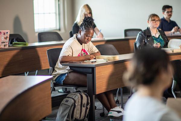 Students taking notes in class