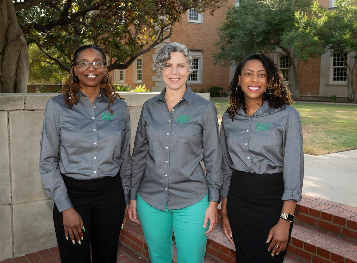 Faculty Success office team standing on the steps of Hurley