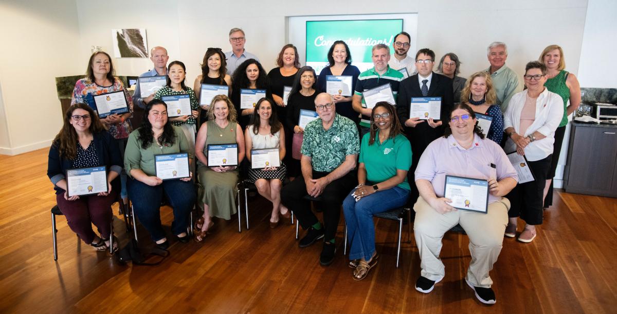 Faculty alumni of the ACUE program pose with certificates with UNT administrators