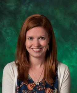 Laura Siebeneck in front of green background