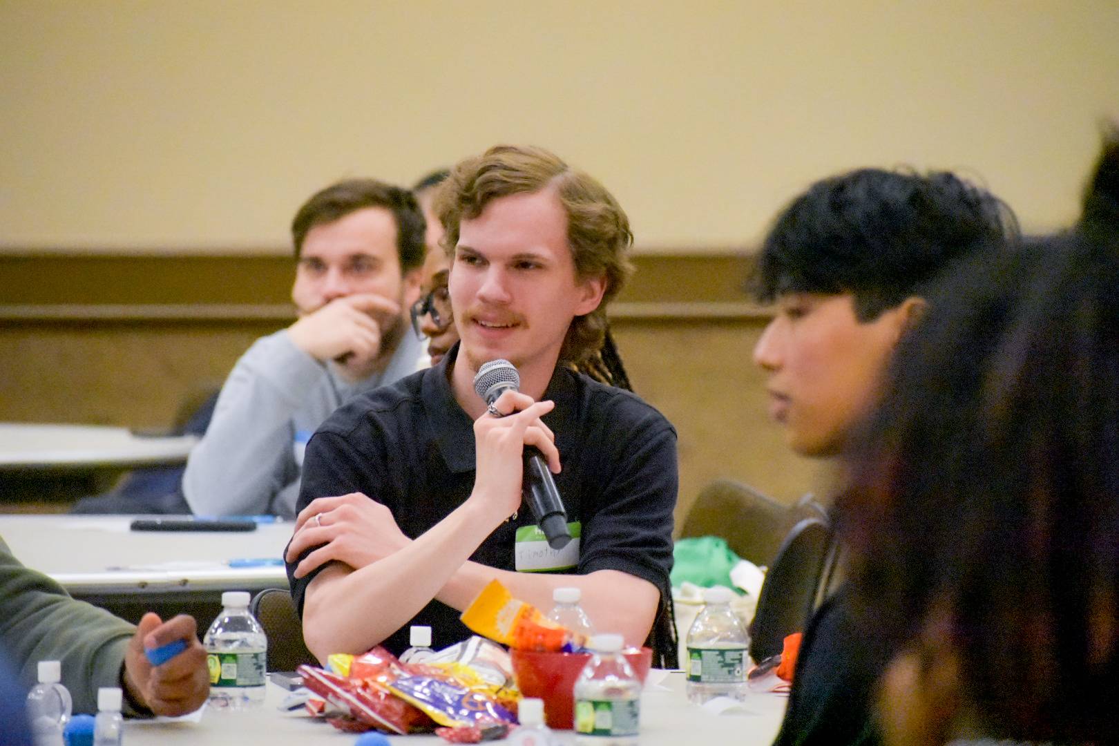 Student speaking into a microphone
