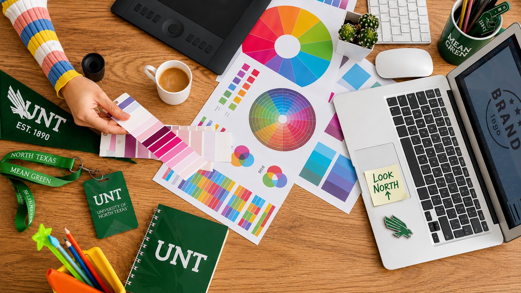 visual arts color wheels on desk with UNT flag and notebook